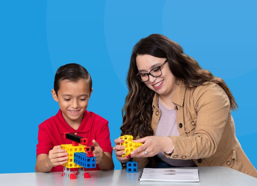 teacher-guiding-student-while-playing-toys-01