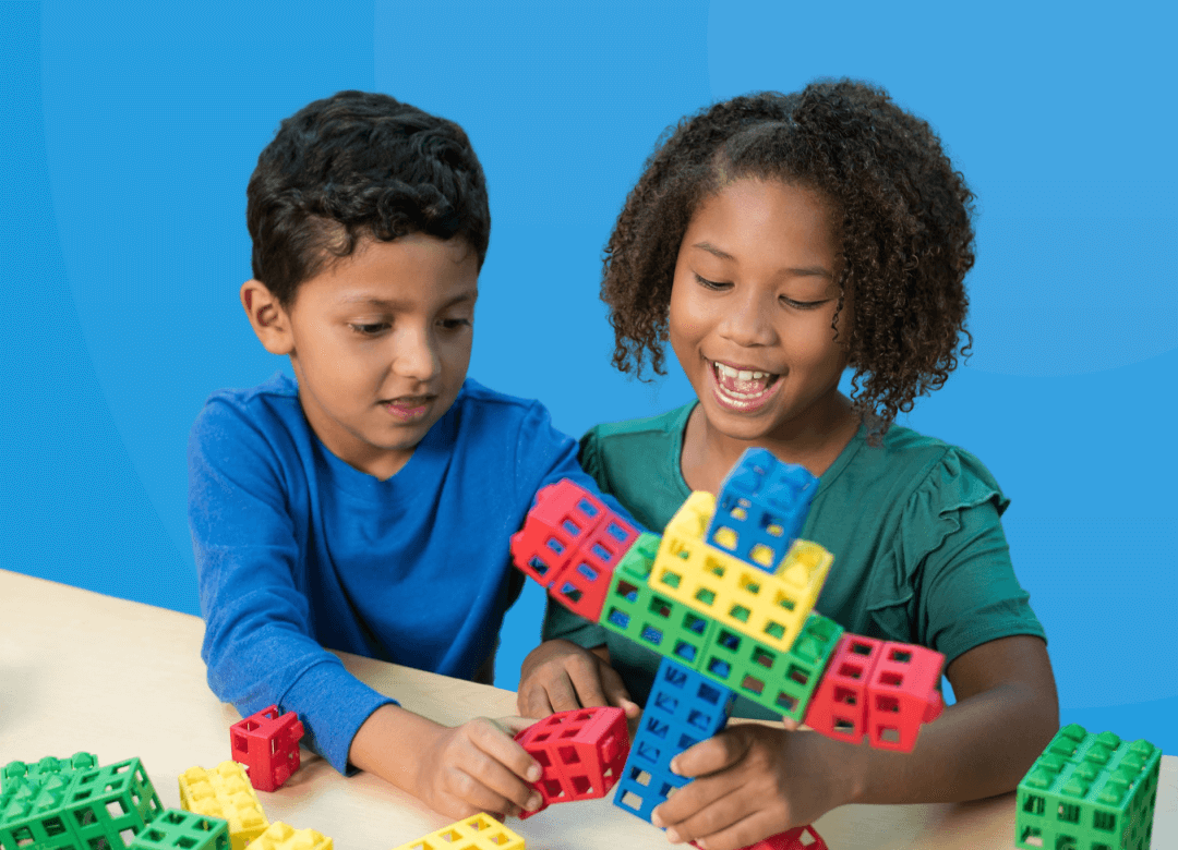 two-students-playing-with-block-a-boy-and-girl