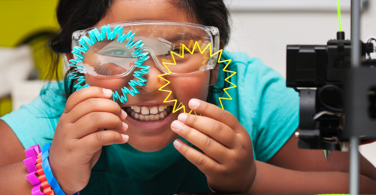 Young female student holding two 3D printed bracelets in front of her face